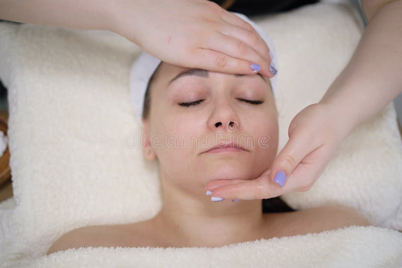 Woman Receiving Head Massage Calm Patient Woman Undergoing The Cosmetic Facial Massage