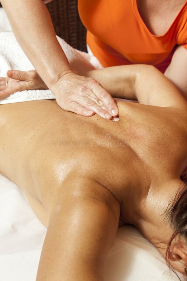 Woman receiving a professional massage and lymphatic drainage -various techniques demonstration