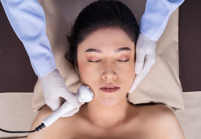 Woman receiving ultrasound facial beauty treatment skin care royalty free stock photos Woman receiving ultrasound facial beauty treatment skin care royalty free stock photos
