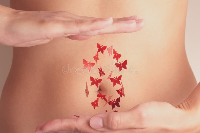 Woman with red flying butterflies between hands. Critical days, woman health or menstruation cycle concept