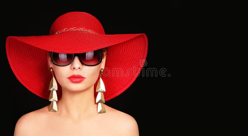 Woman in red hat and sunglasses