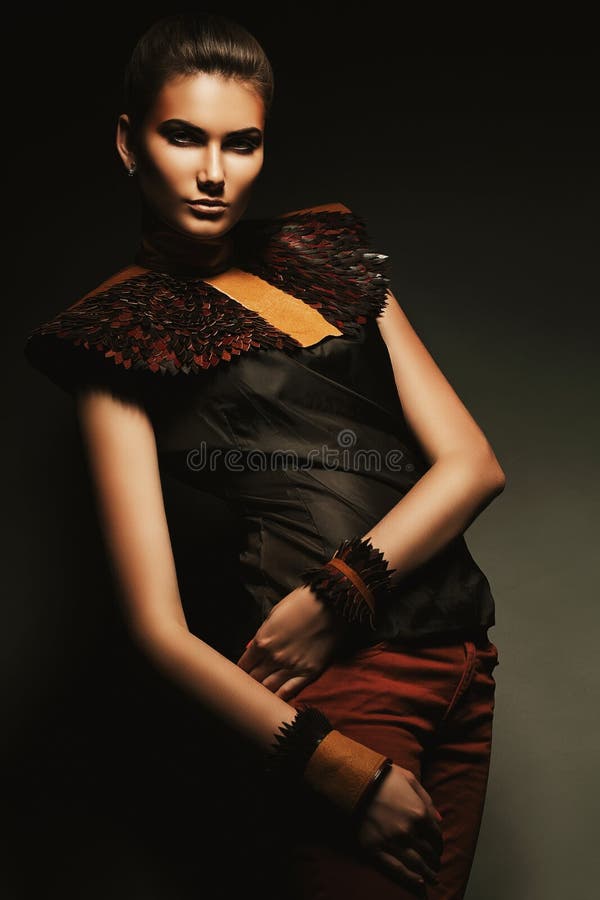 Woman in red jeans and brown accessory stock image