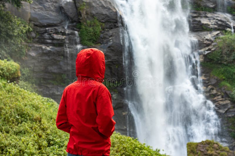 Woman hiker looking on waterfall outdoor. Tourism concept stock photography Woman hiker looking on waterfall outdoor. Tourism concept stock photography