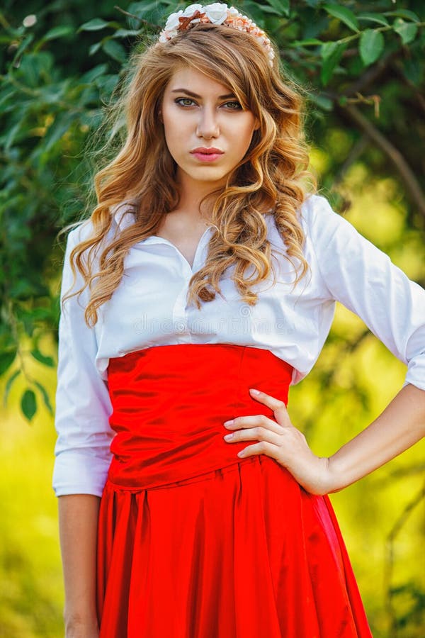 Woman in Red Skirt Standing Under the Tree Stock Photo - Image of alone ...