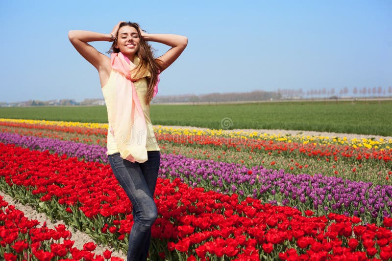 Woman in red tulip field