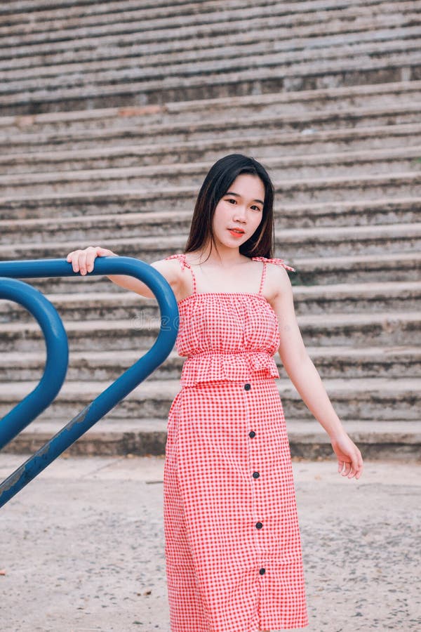 Woman In Red And White Spaghetti Strap Dress Picture. Image: 118464703