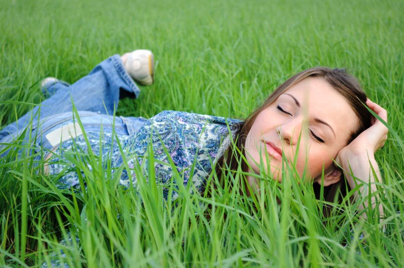 Woman relaxing in field