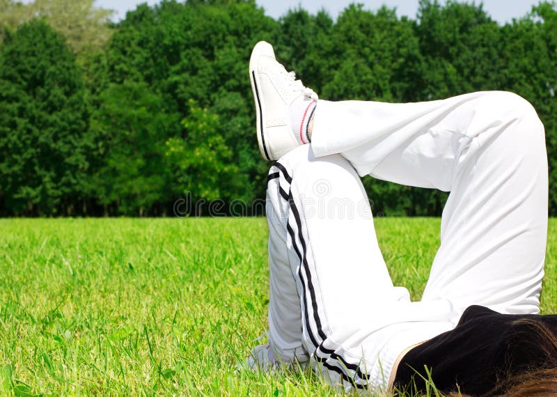 Woman relaxing on grass