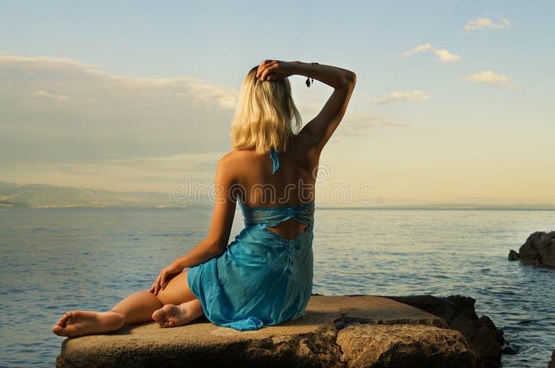 Woman relaxing near the sea