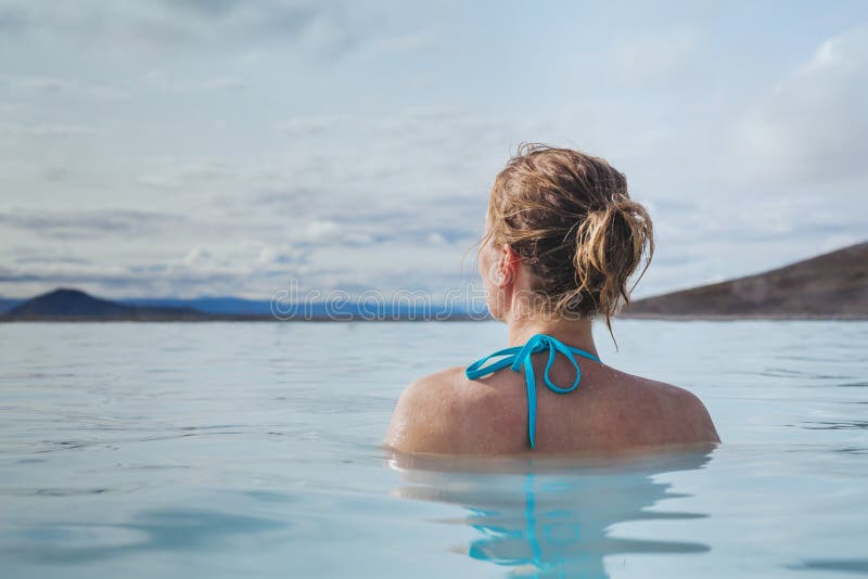 Woman in thermal natural hot spring spa in Iceland, blue lagoon. Woman relaxing in pool spa blue lagoon in Iceland, thermal natural hot spring stock images Woman in thermal natural hot spring spa in Iceland, blue lagoon. Woman relaxing in pool spa blue lagoon in Iceland, thermal natural hot spring stock images