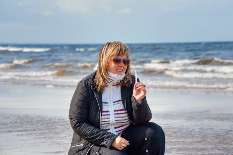 Woman relaxing at the sea.