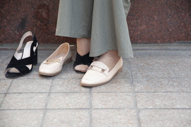 Woman Remove High Shoes in the Street, Stock Photo - Image of female ...