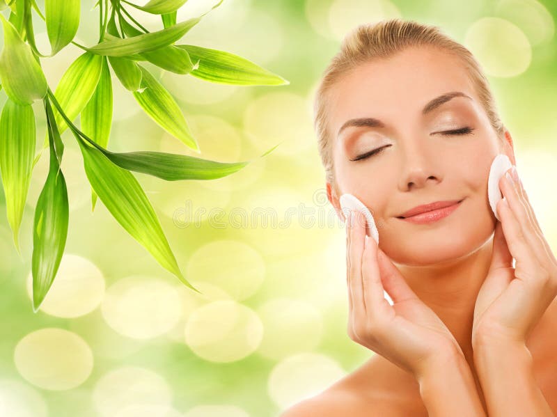 Woman removing cosmetics stock photos Woman removing cosmetics stock photos