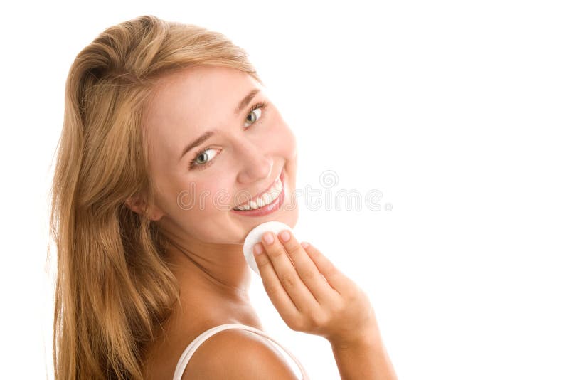 Woman removing makeup stock image