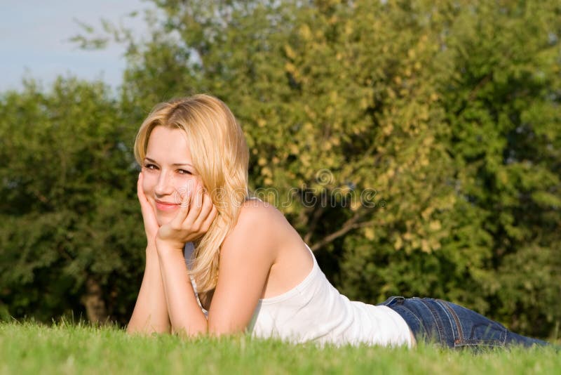 Woman rest on the green grass