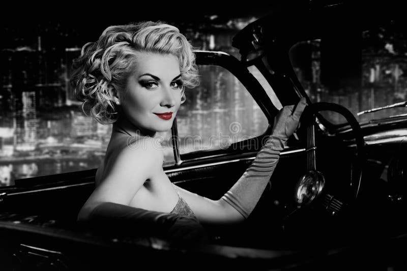 Woman in retro car against