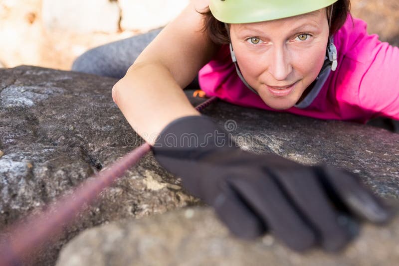 Woman rock climbing stock image. Image of exploration 69810369