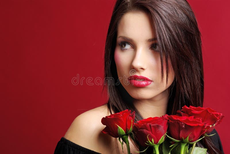 Woman with a rose over red background