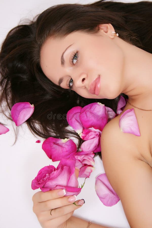 Woman with rose petals