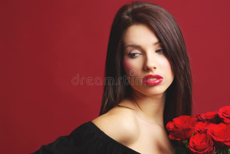 Woman with rose on red background