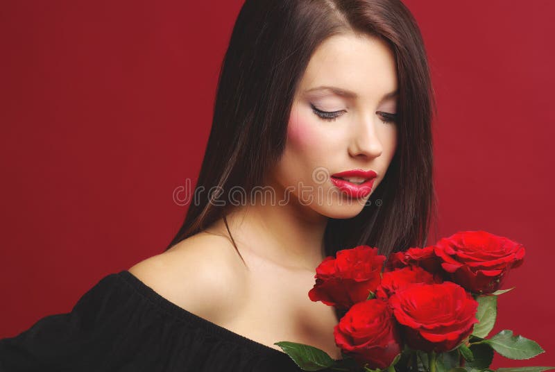 Woman with rose on red background