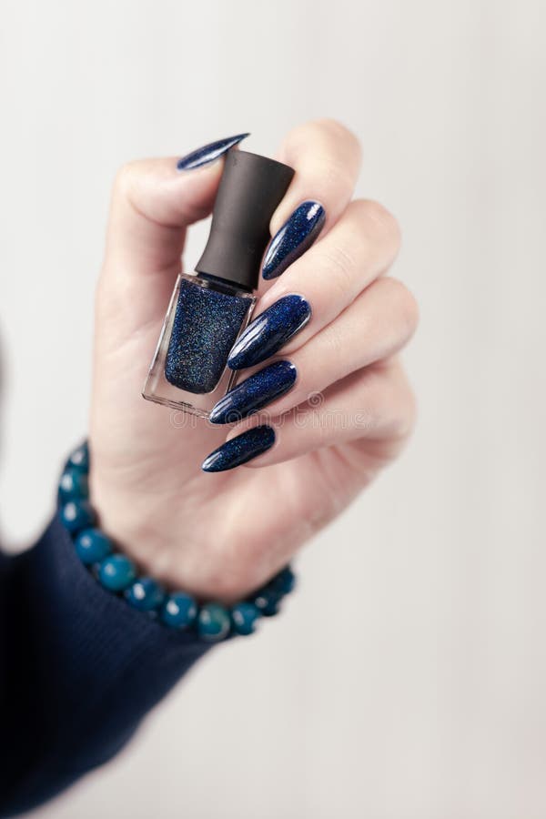 Woman`s Beautiful Hand with Blue Manicure with Bottles of Nail Polish Stock Image - Image of acrylic, feminine: 219526947 Woman`s Beautiful Hand with Blue Manicure with Bottles of Nail Polish Stock Image - Image of acrylic, feminine: 219526947