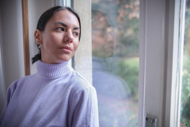Portrait of a sad woman who appears to be in need of support and care. Negative moody stock images, royalty-free photos and pictures