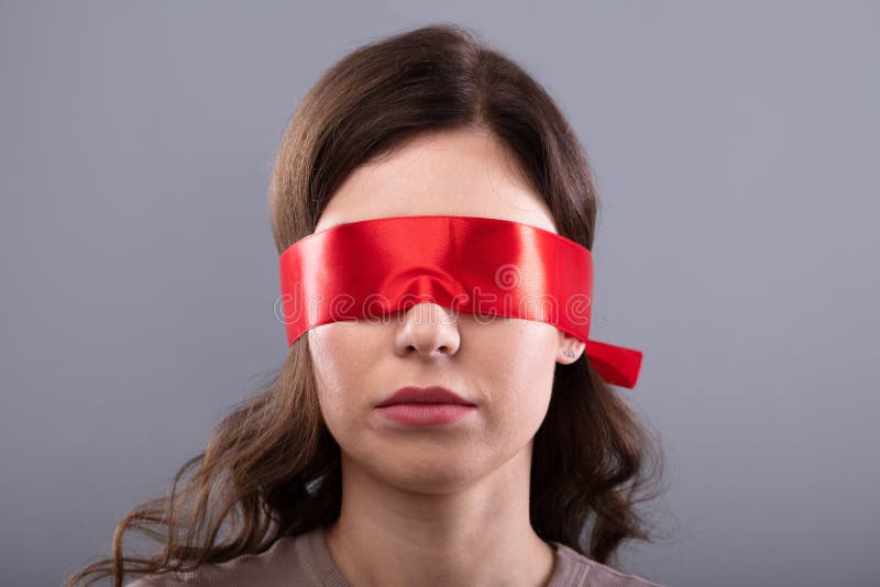 Young Woman Wearing Black Blindfold Isolated On Grey Stock Photo