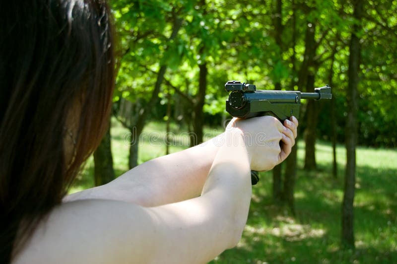 Woman s hand aiming pneumatic gun
