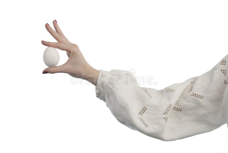 Woman's hand holding the egg