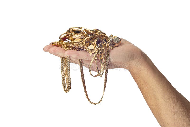 Woman’s Hand Holding Gold Jewelry stock image Woman’s Hand Holding Gold Jewelry stock image