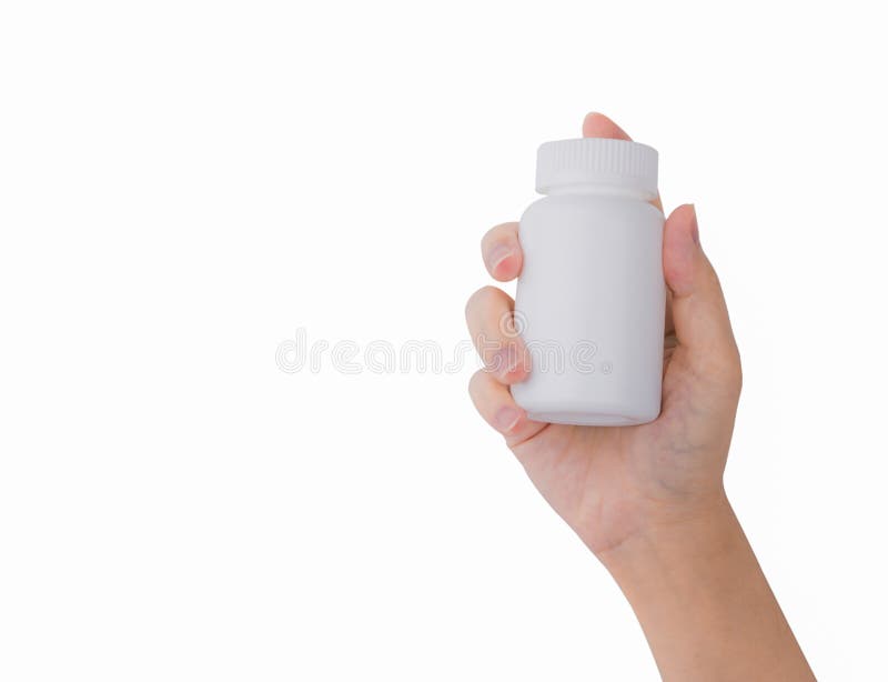 Woman`s hand holding prescription pills bottle with blank label isolated on white background with copy space for text.