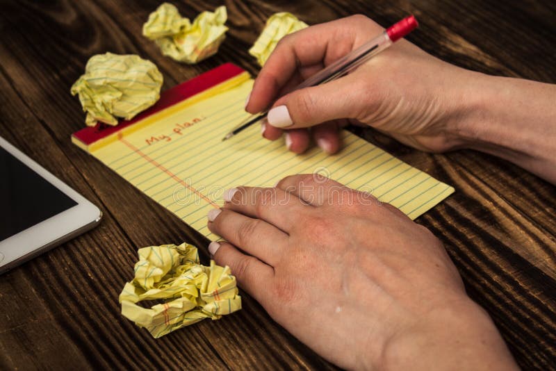 Woman`s hand notebook pen my plan tablet royalty free stock image