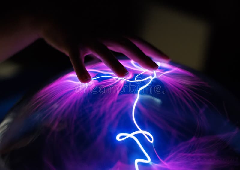 Woman`s hand touching plasma globe. Plasma blast stock images, royalty-free photos and pictures