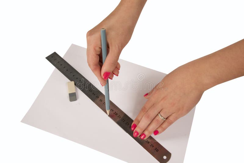 Woman's hands drawing line with pen and ruler stock photography Woman's hands drawing line with pen and ruler stock photography