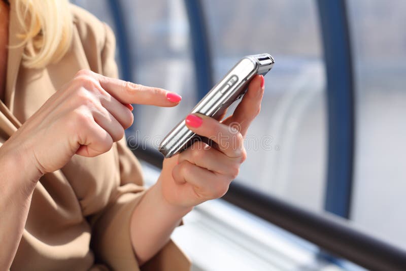 Woman`s hands with pda