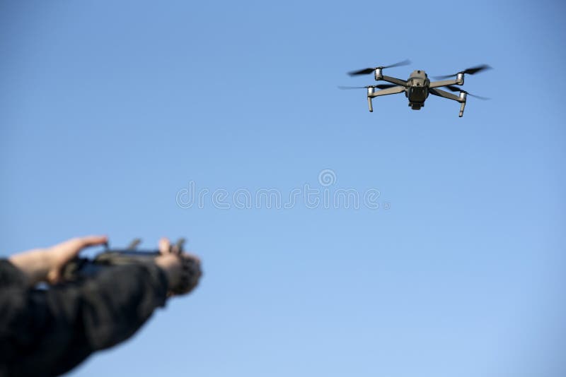 Woman`s Hands on Remote Controller that Controls the Drone. Drone