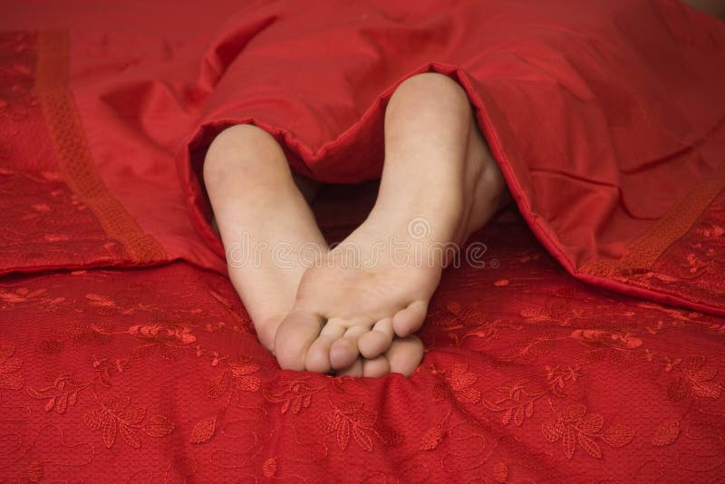 Woman s legs in bed stock photo. Image of beautiful, sensuality 13374706