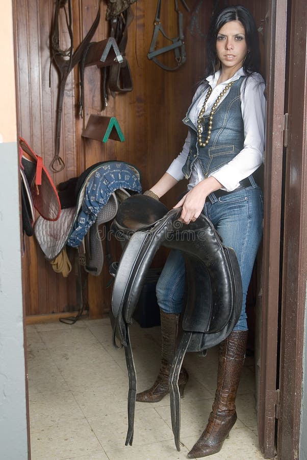 Woman in a saddle room
