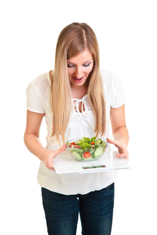 Woman with salad and scales