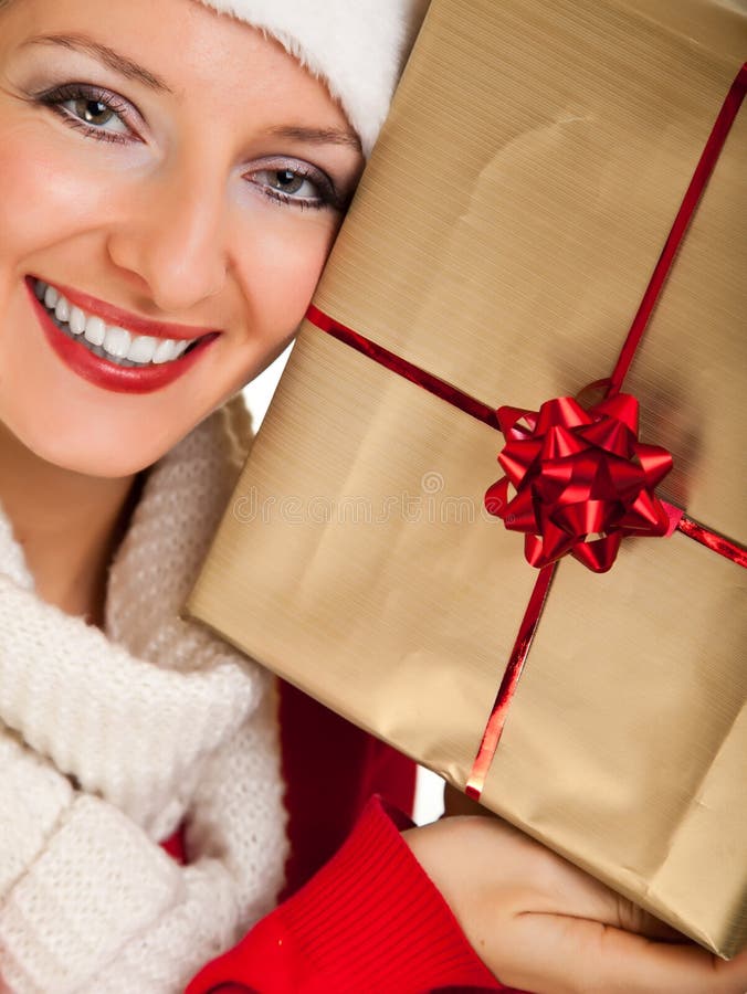 Woman in santa hat with presents