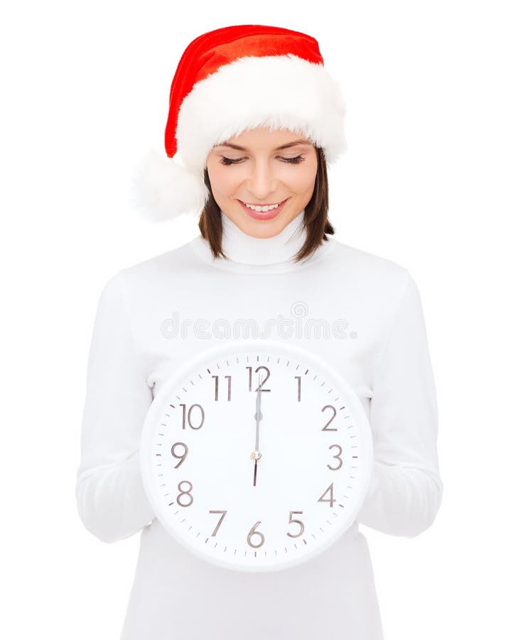 Woman in santa helper hat with clock showing 12