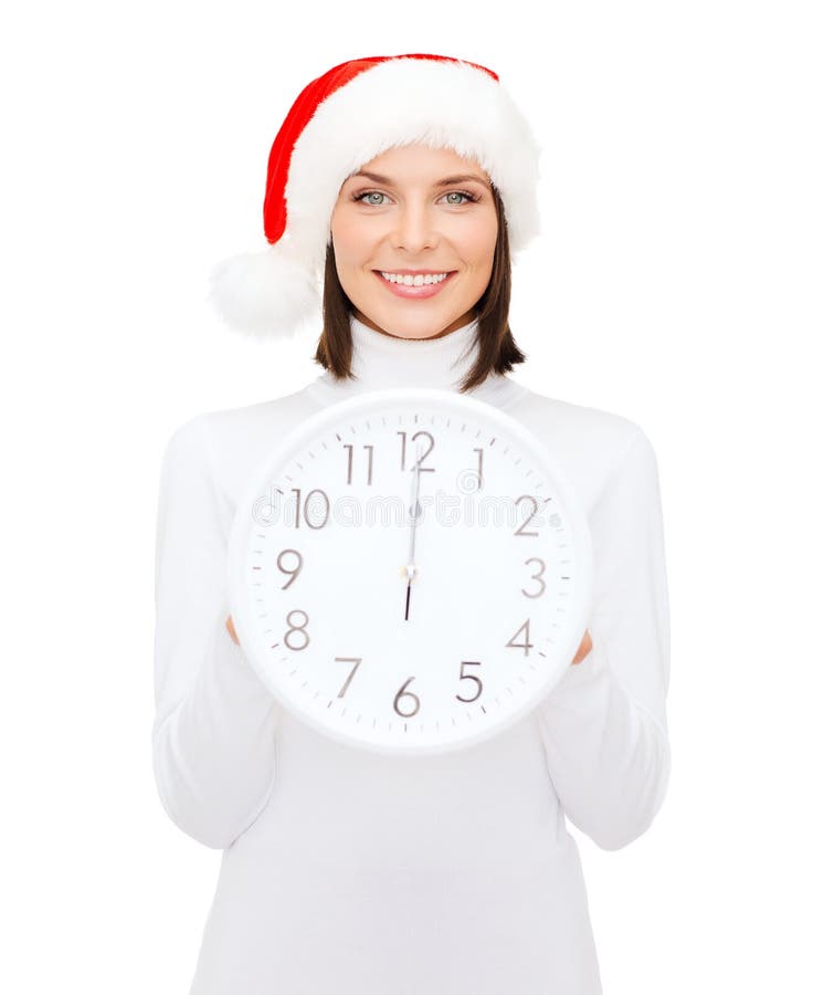 Woman in santa helper hat with clock showing 12
