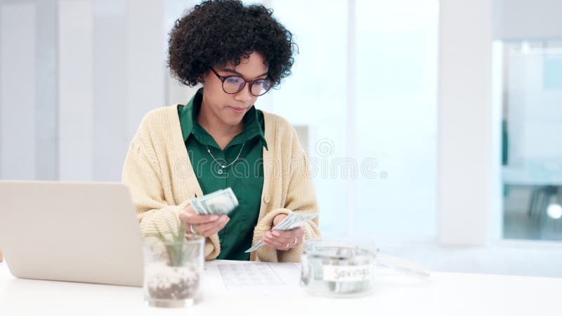 Woman, savings and planning budget with cash in dining room for insurance, bills and taxes return. Mixed race lady