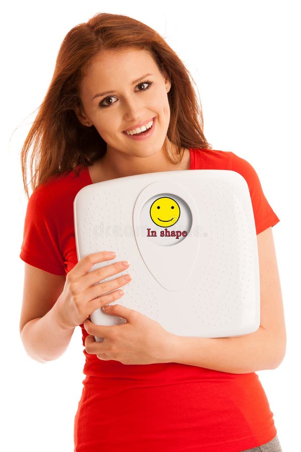 Woman with scale happy with her weight isolated over white background