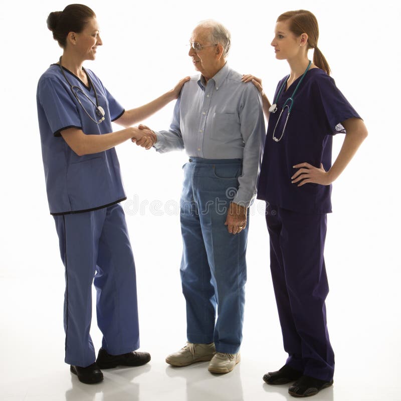 Woman in scrubs shaking hands