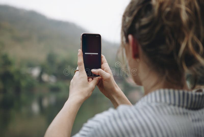 Woman searching for signal with her mobile phone royalty free stock photo Woman searching for signal with her mobile phone royalty free stock photo