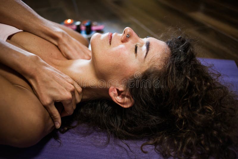 Woman self  massage her neck at home improve  immune system and reduce  pain and tension