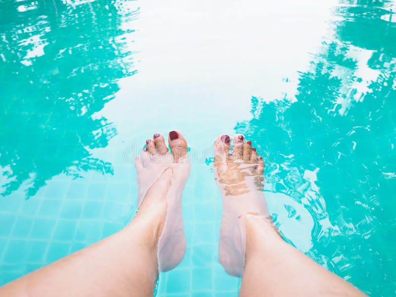 Woman selfie barefoot in the water at swimming pool royalty free stock image Woman selfie barefoot in the water at swimming pool royalty free stock image