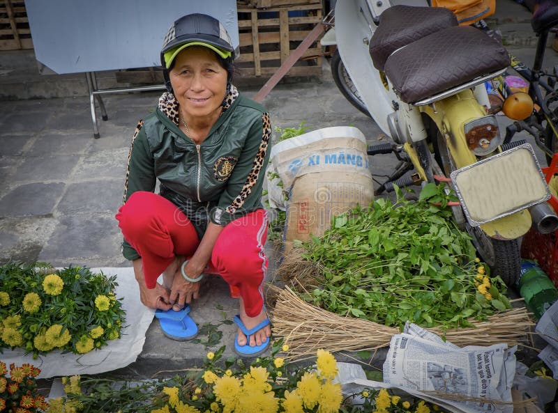 Woman Selling Flowers, Hoi An, Vietnam stock photography Woman Selling Flowers, Hoi An, Vietnam stock photography